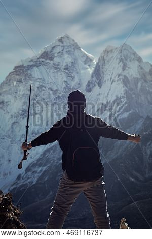 A Silhouette Of A Man In Nepal Is Overlooking The Ama Dablam Mountain In The Dingboche Village Into 