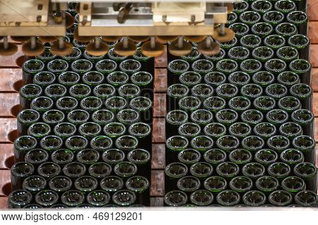 Production Of Cremant Sparkling Wine In Burgundy, France. Automatically Powered Bottling And Riddlin