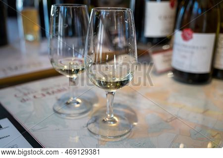 Tasting Of White Dry Chablis Wine In Small Winery In Chablis Town, Burgundy, France