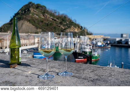 Tasting Of Txakoli Or Chacolí Slightly Sparkling Very Dry White Wine Produced In Spanish Basque Coun