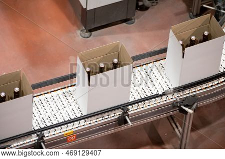 Production Of Cremant Sparkling Wine In Burgundy, France. Automatically Powered Bottling And Corking