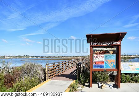 Huntington Beach, California - 18 Jan 2023: Sign And Boardwalk At The Bolsa Chica Ecological Reserve