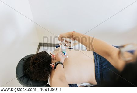 Professional Physiotherapy Treatment With Cupping On A Lying Patient. Modern Physiotherapy With Cupp