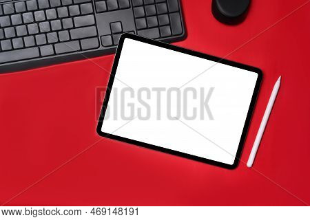 Top View Digital Tablet With Empt Display On Red Background.