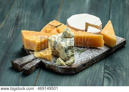 Different Types Of Cheese. Cheeses Mix Set Dor Blu Chedar Camamber Brie. Place For Text, Top View.