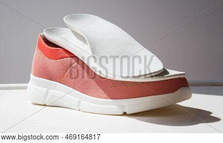 Leather Orthopedic Insoles Located On Sport Shoe With Orthopedic Sole.  Treatment And Prevention Of 