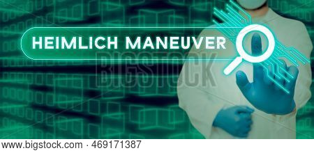 Hand Writing Sign Heimlich Maneuver. Word Written On Application Of Upward Pressure In Case Of Choki