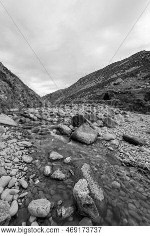 Long Exposure Of The River Heddon Flowing Onto The Beach At Heddons Mouth In Exmoor