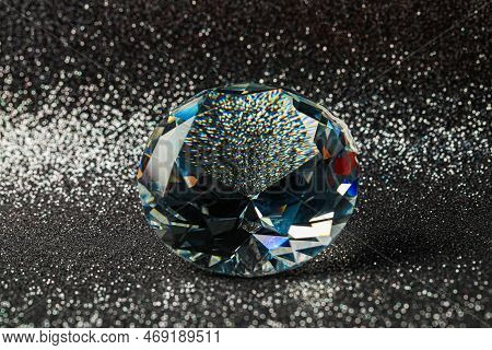 Beautiful Dazzling Diamond On Shiny Glitter Background, Closeup. Precious Gemstone