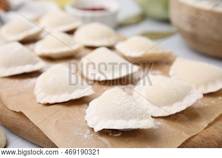 Raw Dumplings (varenyky) With Tasty Filling On Light Grey Table, Closeup