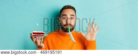 Close-up Of Funny Adult Man Celebrating His Birthday, Holding Bday Cake With Candle, Blowing Party W