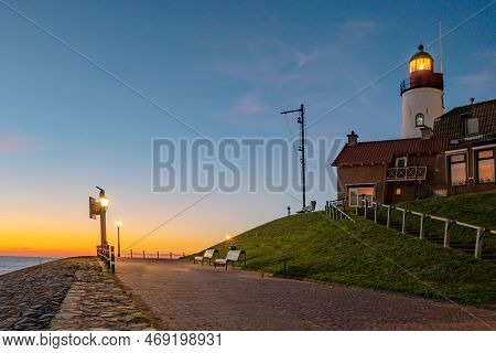 Urk Flevoland Netherlands Sunset At The Lighthouse And Harbor Of Urk Holland. Fishing Village Urk