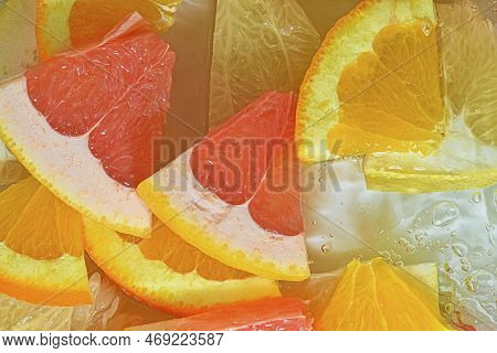 Slices Of Grapefruit, Orange And Pomelo In Water On White Background. Pieces Of Grapefruit, Orange F