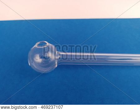 New Unused Methamphetamine Glass Pipe On A Blue And White Background For Educational Purposes