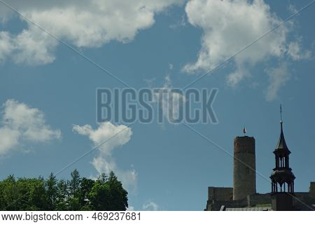 Blue Sky, With Delicate Tiny Clouds, Above The Town Of Checiny Near Kielce .visible Green Trees And 