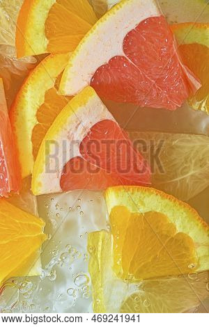 Slices Of Grapefruit, Orange And Pomelo In Water On White Background. Pieces Of Grapefruit, Orange F