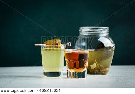 Pickleback, Alcoholic Cocktail Made From Cucumber Pickle And Whiskey In Small Shot Glasses