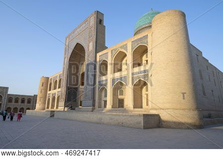 Bukhara, Uzbekistan - September 08, 2022: At The Medieval Madrasah Miri-arab On A Sunny Evening