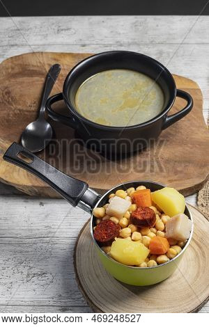 Cooked (cocido, Guiso) Stew, Chickpeas With Chorizo, Bacon, Carrot And Potato In Green Saucepan, Bla