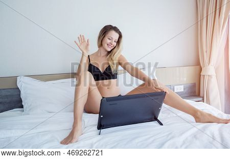 Young Sexy Woman Posing In Front Of Camera And Working As Webcam Model