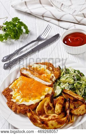 Chicken Parmo, Chicken Breast Cutlet Deep-fried In Breadcrumbs, Slathered With Creamy Sauce And Melt