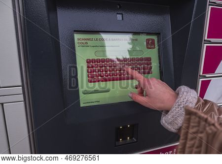 Loriol Sur Drome, France - January 14, 2023: Picking Up A Parcel From A Mondial `relay Locker By A Y