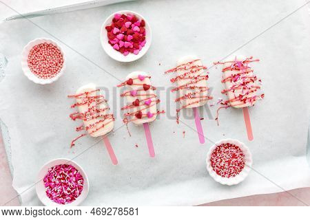 Freshly Decorated Homemade Valentine Cakesicles With Candy Melts And Sprinkles.