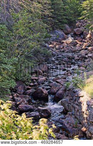 A Cascading Stream That Flows Into The Atlantic Ocean. Kennington Cove, Cape Breton, Nova Scotia, Ca