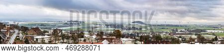 Winter Rural Landscape With Cloudy Sky, In The Foreground Town Schieder-schwalenberg In The State Of