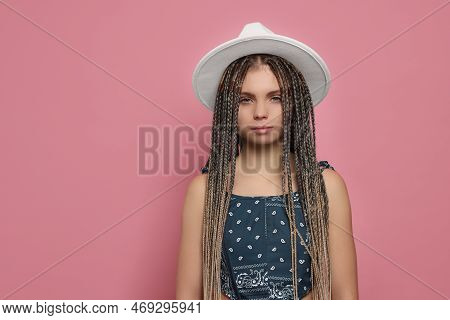 Beautiful Woman With Long African Braids And Hat On Pink Background, Space For Text