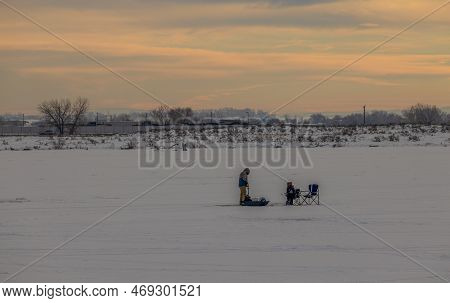 Longmont, Colorado - January 8, 2023: Ice Fishing On Blue Heron Reservoir In St. Vrain State Park, L