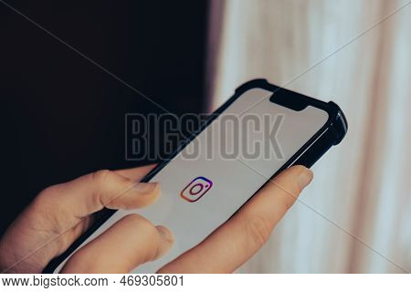 Gdansk, Poland - June 2022: Female Hand Scrolling Social Media Feed On Instagram Phone. Using Social