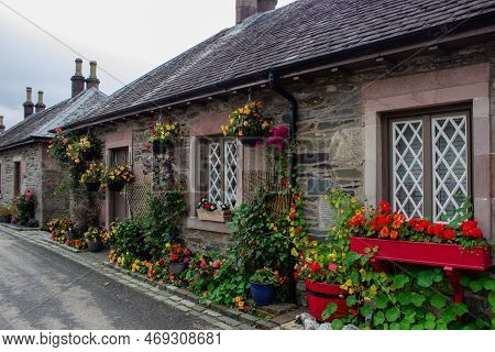 Beautiful Little Old House With Flowers In Village Of Luss Scotland