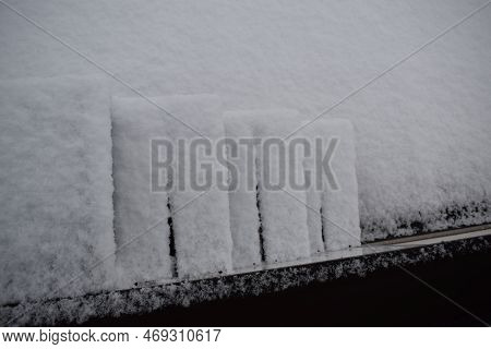 Snow Covered Stairway At A House Front