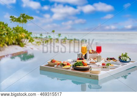 Breakfast In Swimming Pool, Floating Breakfast In Luxurious Tropical Resort. Table Relaxing On Calm 