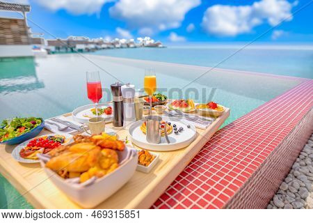 Breakfast In Swimming Pool, Floating Breakfast In Luxurious Tropical Resort. Table Relaxing On Calm 