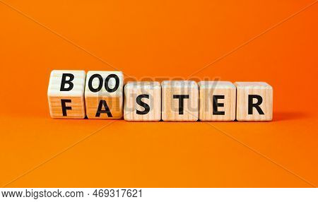 Booster And Faster Symbol. Concept Word Booster Faster On Wooden Cubes. Beautiful Orange Table Orang