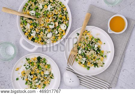 Salad Of Vegetables, Pasta And Mozzarella In A Dish On A Light Background. Top View.
