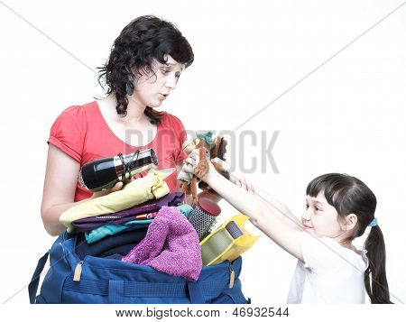 Woman And Daughter Hand Crammed Full Of Clothes And Shoulder Bag Isolated
