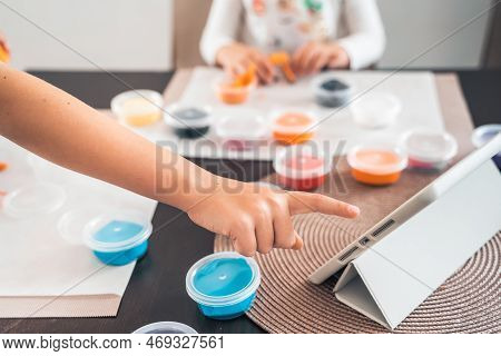 Little Girls Sculpt Figurines Crafts From Air Plasticine, Modeling Dough.online Lessons In Tablet. C