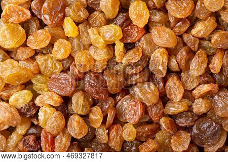 Flat Background Of Raisins. Tasty Juicy Raisins From Grape