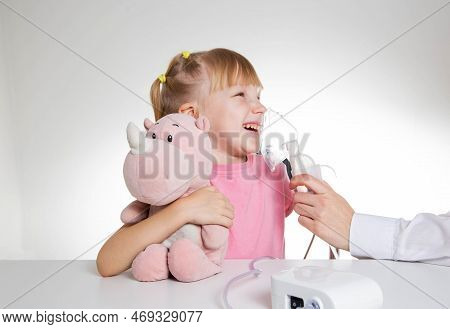 A 5-year-old Girl Breathes Into An Inhaler To Dilute Sputum In Case Of Lung Diseases. Treatment Of C