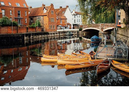Houses And Boats On The River Yare At Norwich City Centre In Norfolk In Autumn. Townhouses Buildings