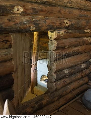 The Construction Of A Dugout From Wooden Logs And Stove Heating. Copy Space For Text
