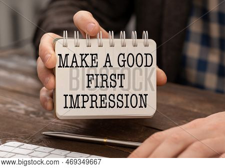 Businessman Holding A Card With Text Make A Good First Impression