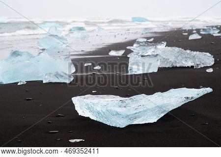 Diamond Beach In Iceland. Incredible Landscape With Pure Blue Icebergs On Black Sand. Shore Near Jok
