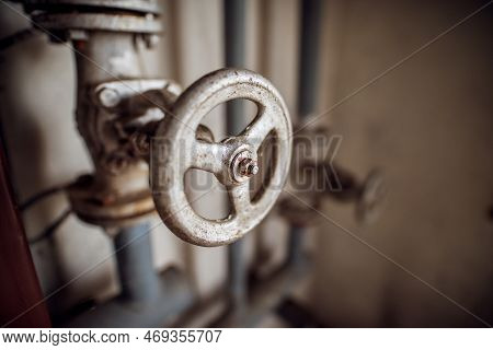 Close Up Focus View Of Industrial Valve Wheel And Stem.