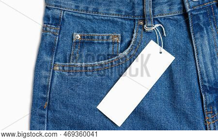 Front Side Pocket And Price Tag Of Blue Jeans Pants Close-up Isolated On White Background, Mockup. F
