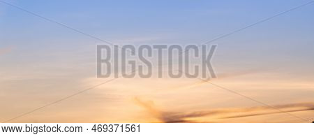 Beautiful Sky Painted By The Sun Leaving Bright Golden Shades.dense Clouds In Twilight Sky In Winter