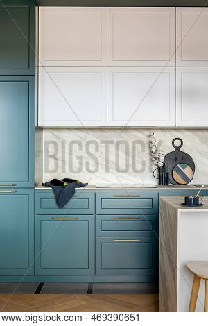 Luxury Modern And Vintage Turquoise And White Kitchen. Marble Wall With White Cabinets. Black Vase W